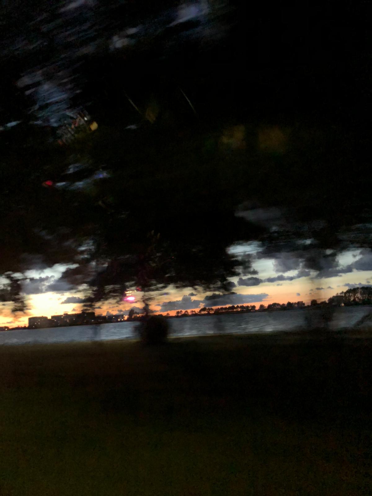 Photo of a lake taken from a moving car