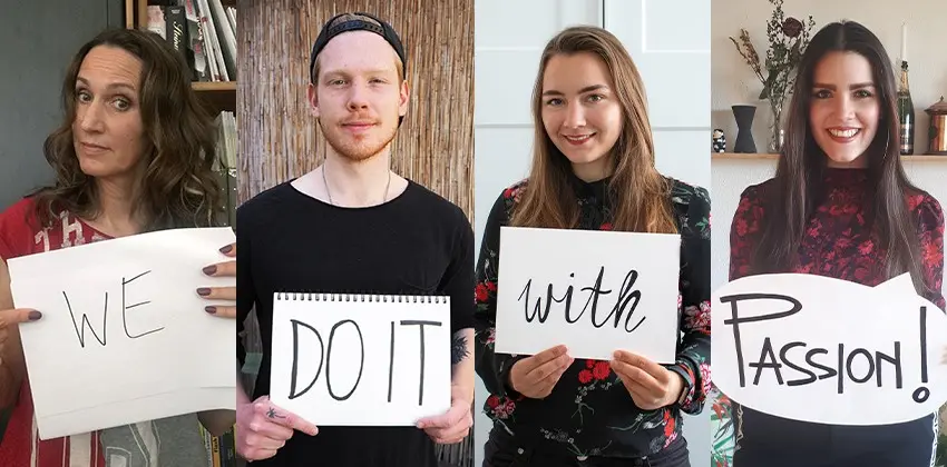 Designer:innen von Drive, die Blätter mit der Aufschrift "We do it with passion!" halten.